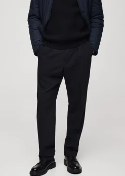 MANGO Spodnie*Spodnie regular fit z lejącej tkaniny z zaszewkami